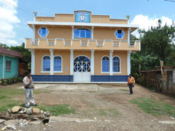 a mountain church building 
that has been in a buliding phase 24 years