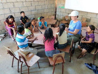 Lily sharing stories of Jesus with the children